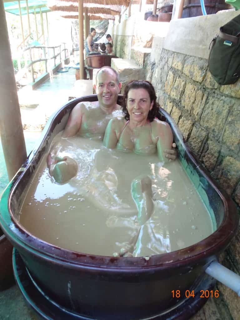 Two people in a mud tub
