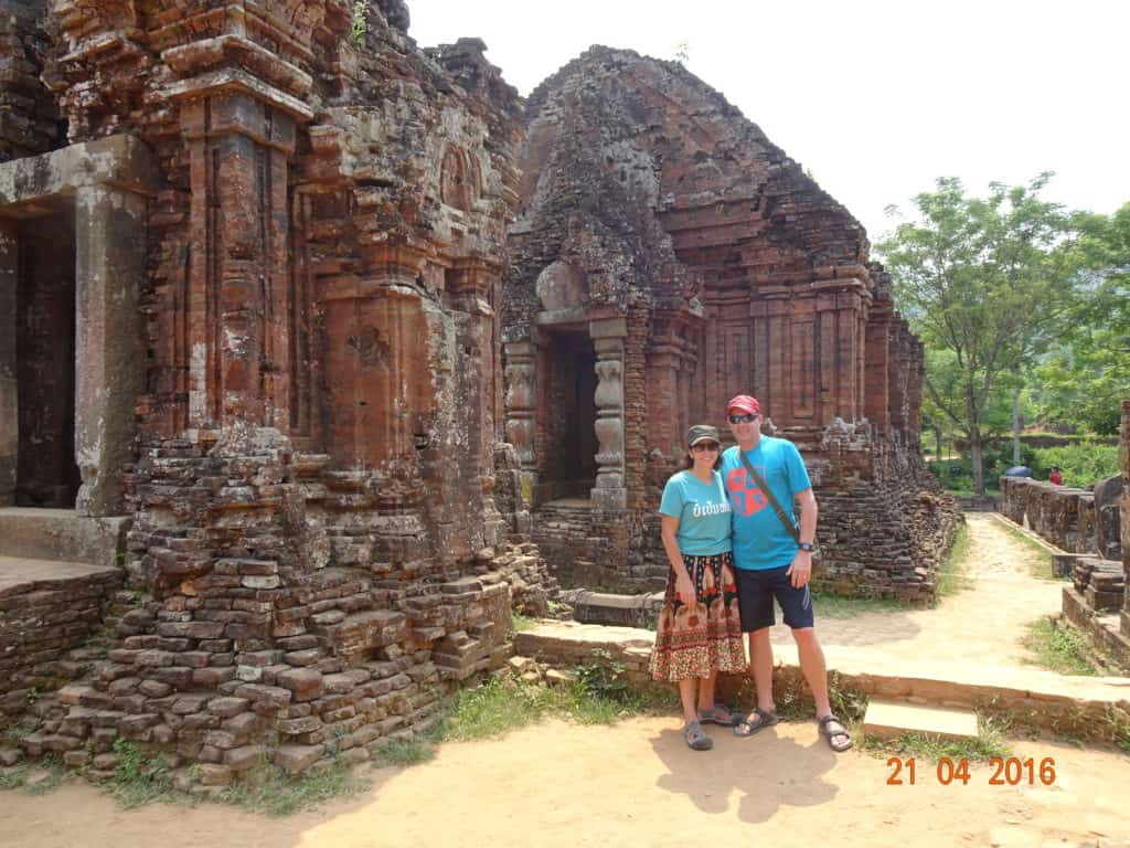 Man and woman in front of two temples