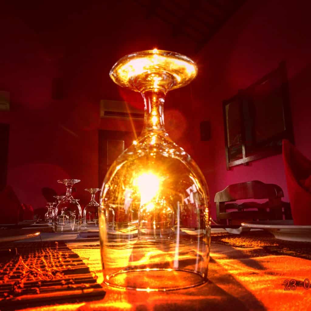 Upturned wine glass with sun glow 