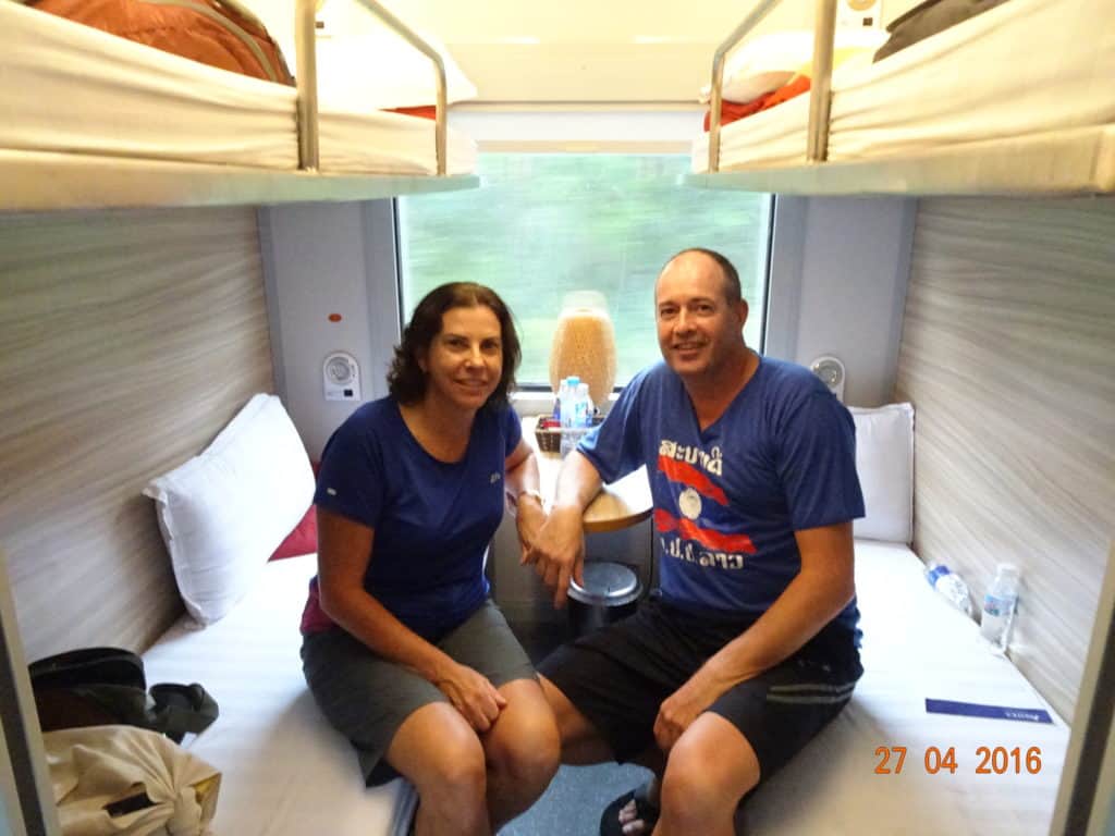 Man and woman in a four berth train cabin