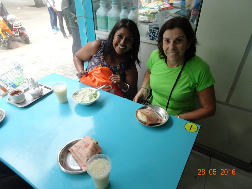 Two ladies at a table with food