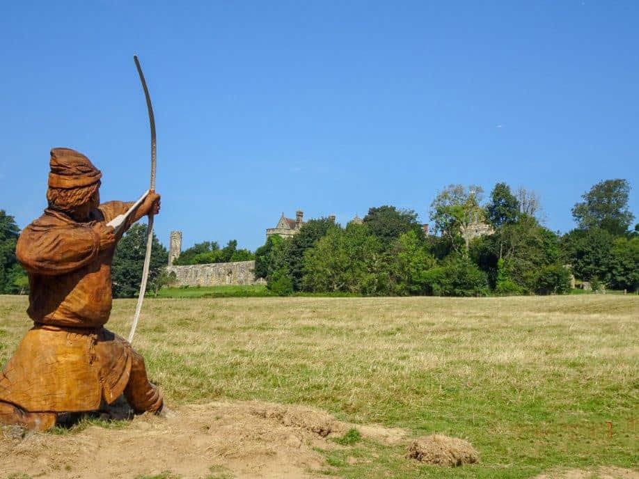 Wooden man with bow and arrow