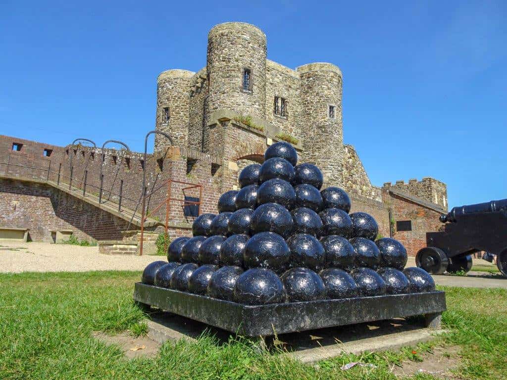 Cannon balls in front of a stone castle