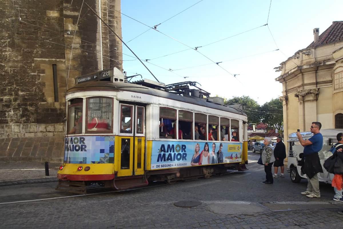 An old yellow tram with Number 28 showing