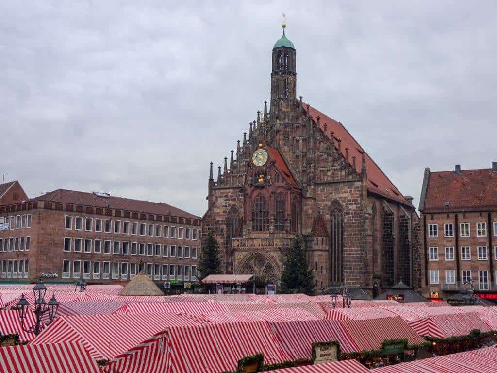 Chuurch with red and white roofs below