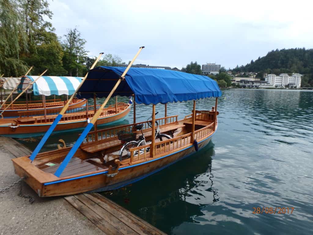 Long boat with two oars and a canopy