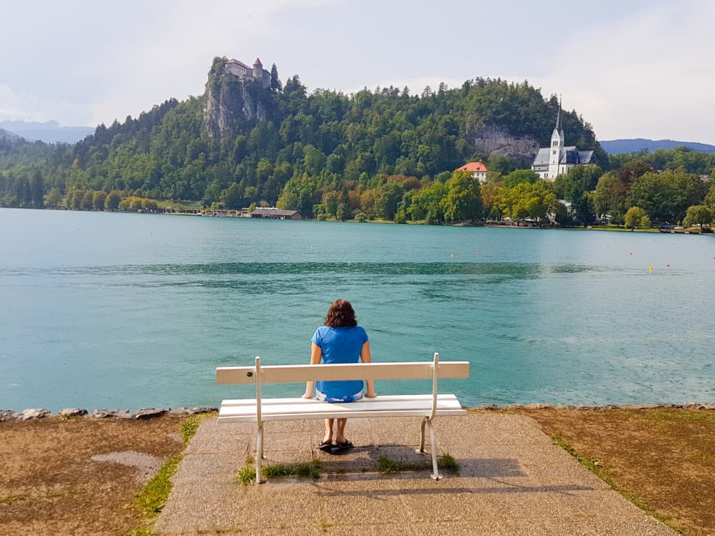 Woman sitting with a view of a lake
