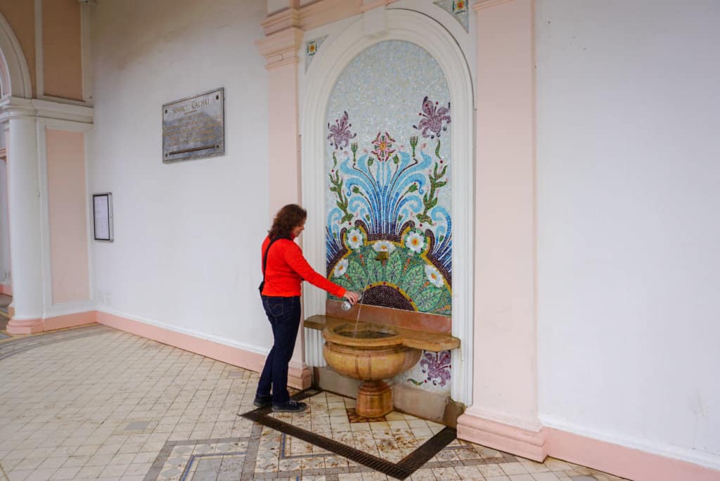Woman at a water fountain