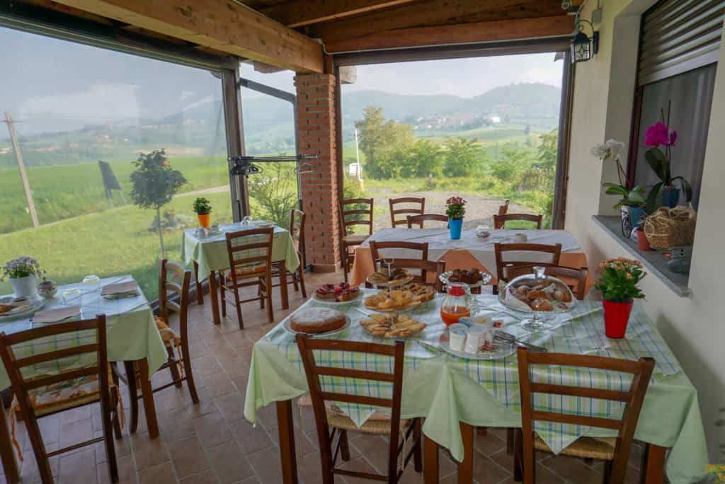 Dining table set with food and view of the green fields