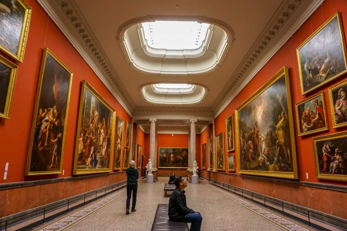Picture gallery room with walls of red