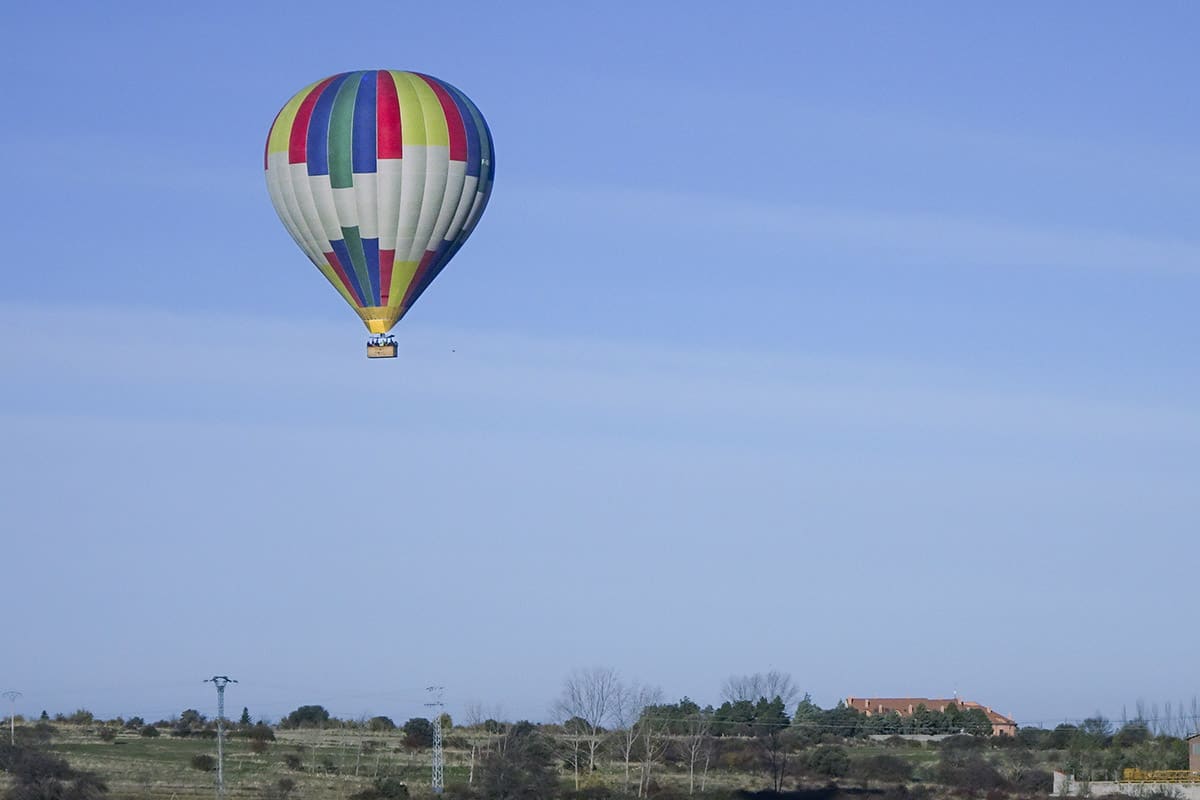 Hot air balloon over a field