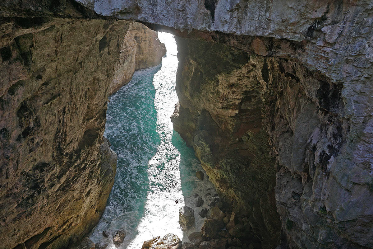 A narrow inlet from the sea in a grotto