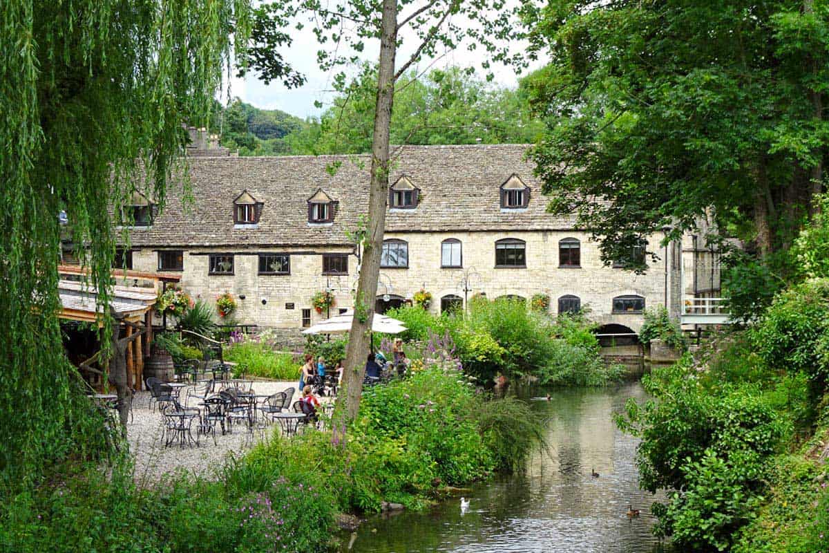 A large inn next to a waterway