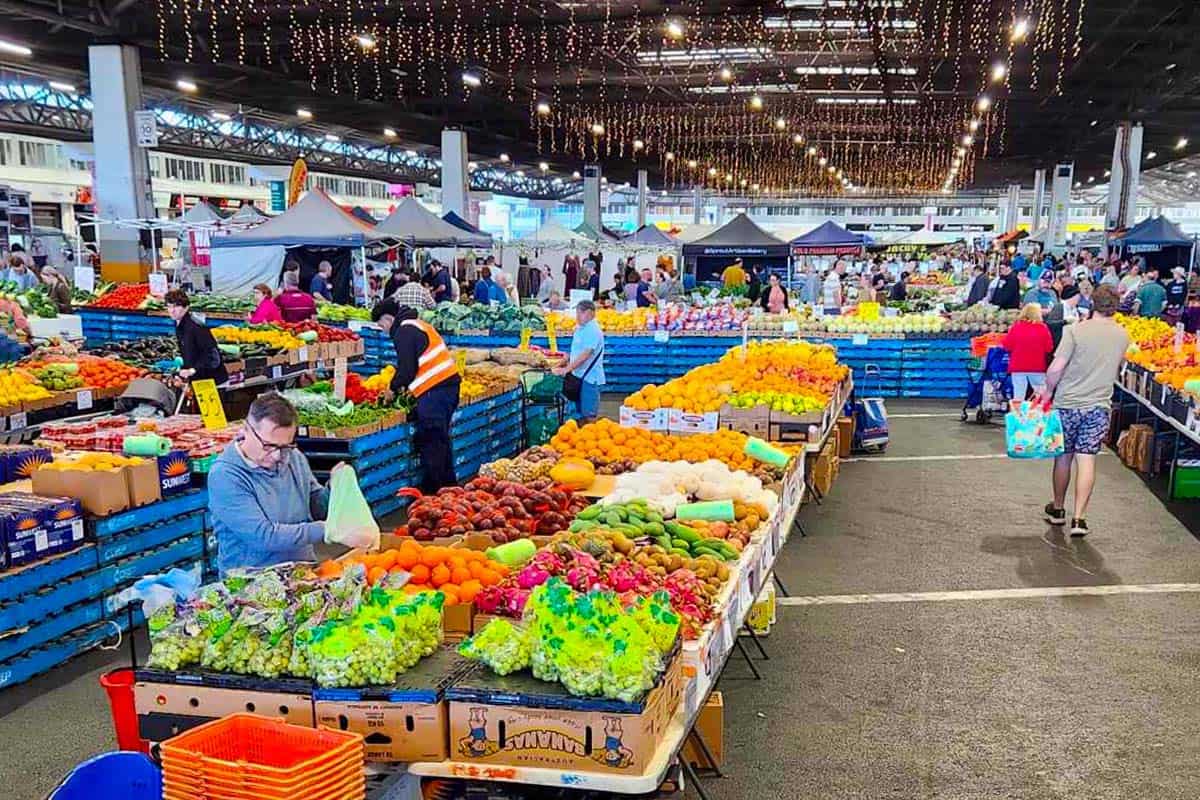 Indoor fresh market with lots of colourful veges and fruit