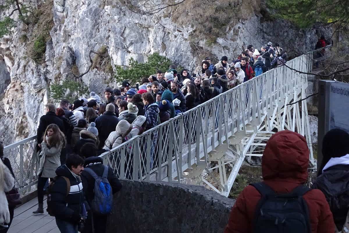 A crowd of people on a bridge